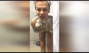 A girl from Russia takes a camera phone in the bathroom