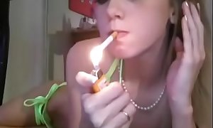 Super cute blonde girl smoke and masturbate on cam
