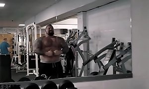 Super massive muscle bear flexing